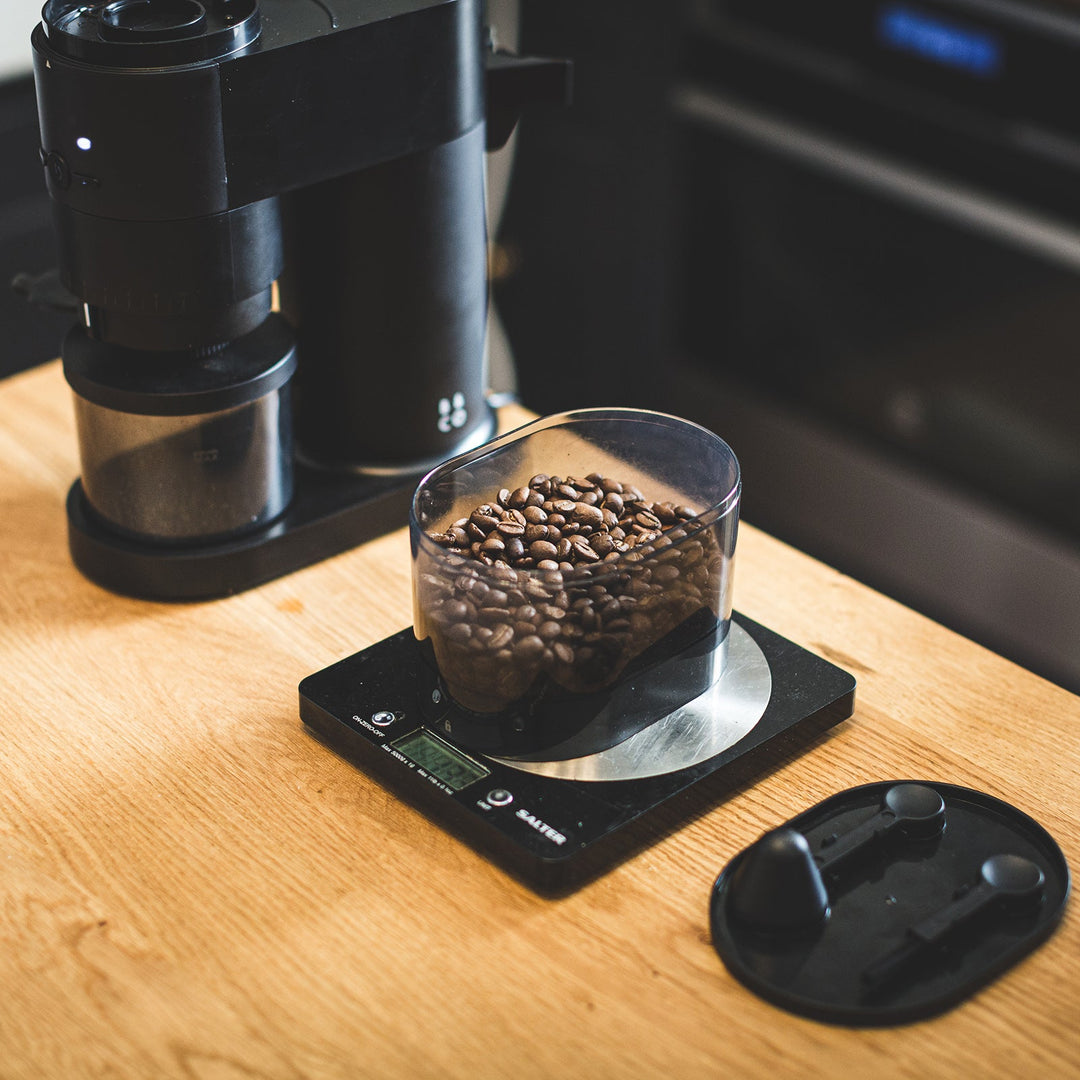 Fresh coffee beans on scales